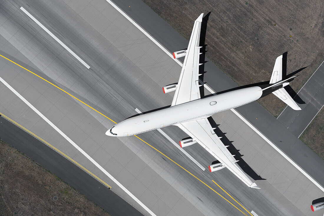 View from above airplane on airport runway