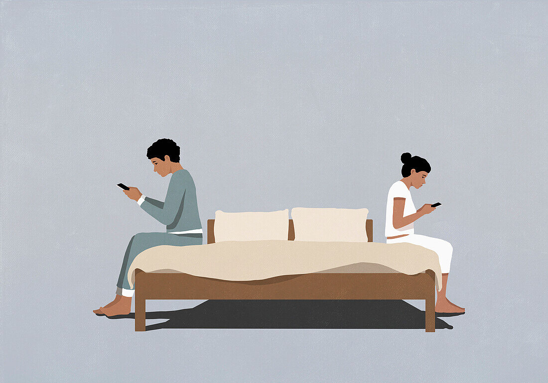 Distracted couple using smart phones back to back on bed