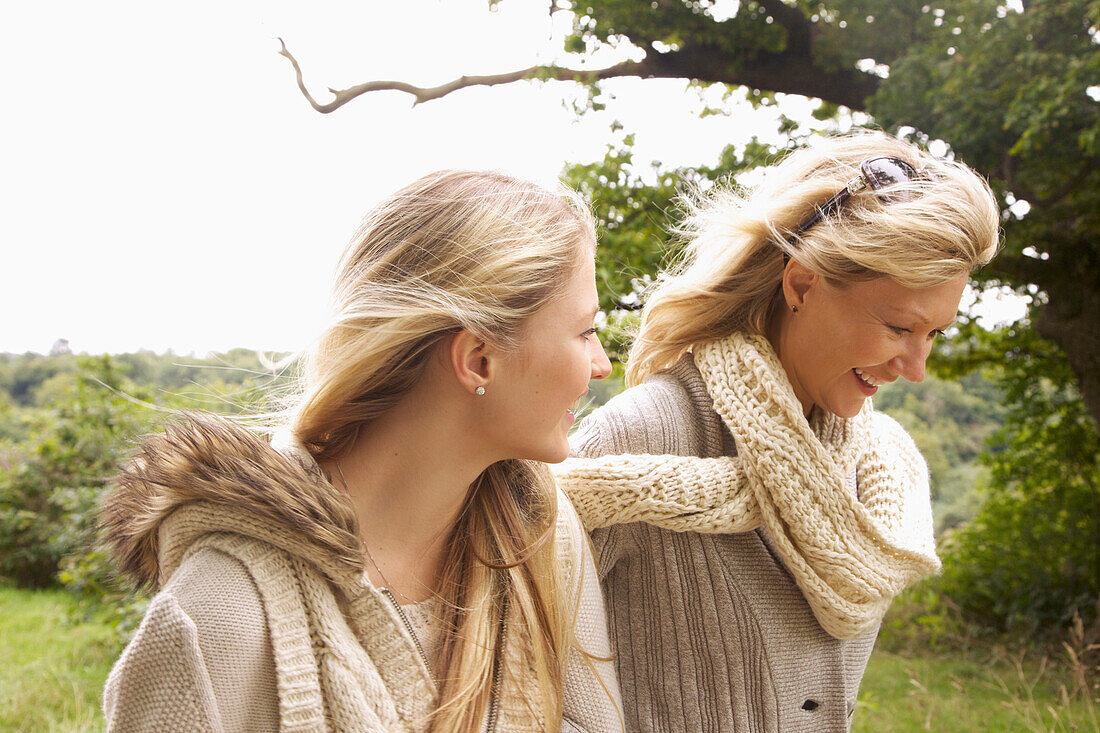 Mother and Daughter Walking in Countryside