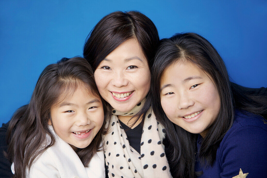 Mother and her Daughters Smiling