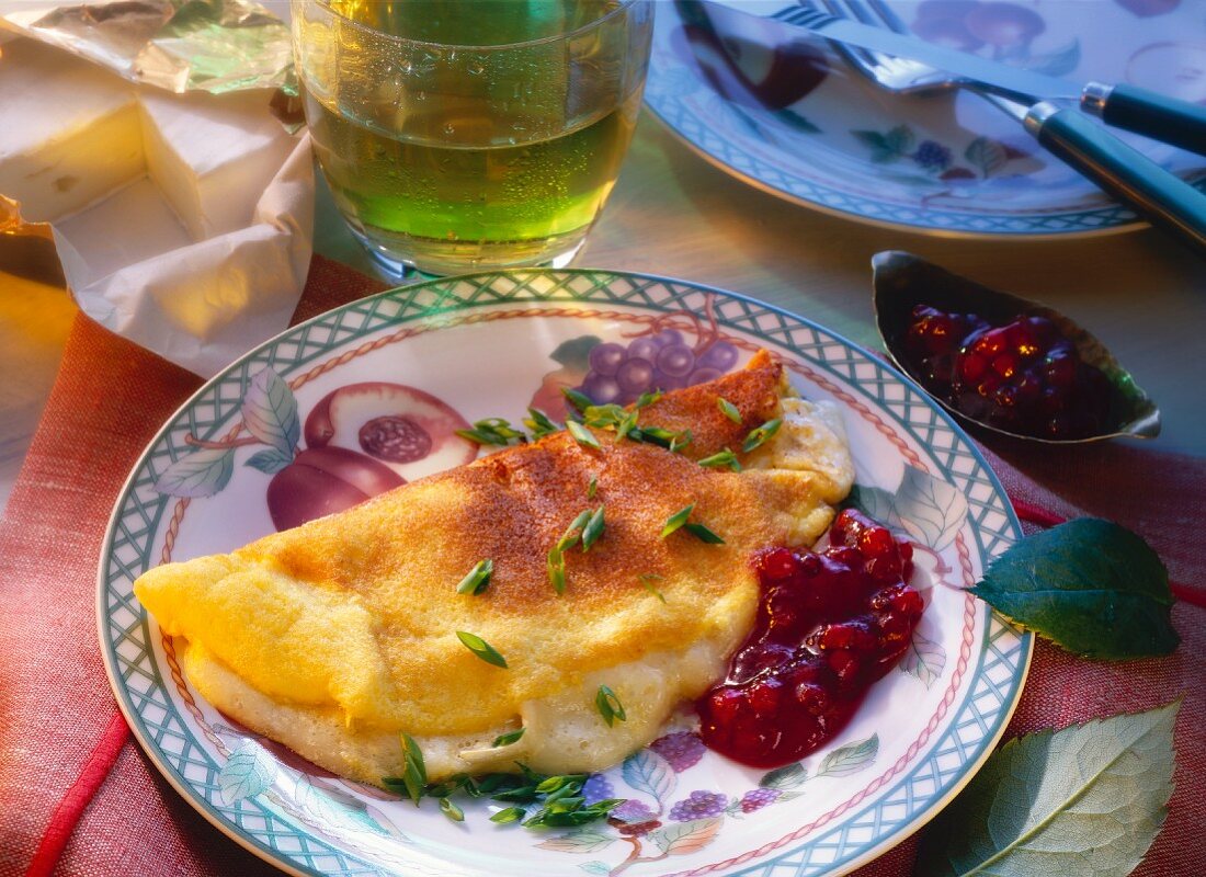 Omelette with camembert filling and cranberries