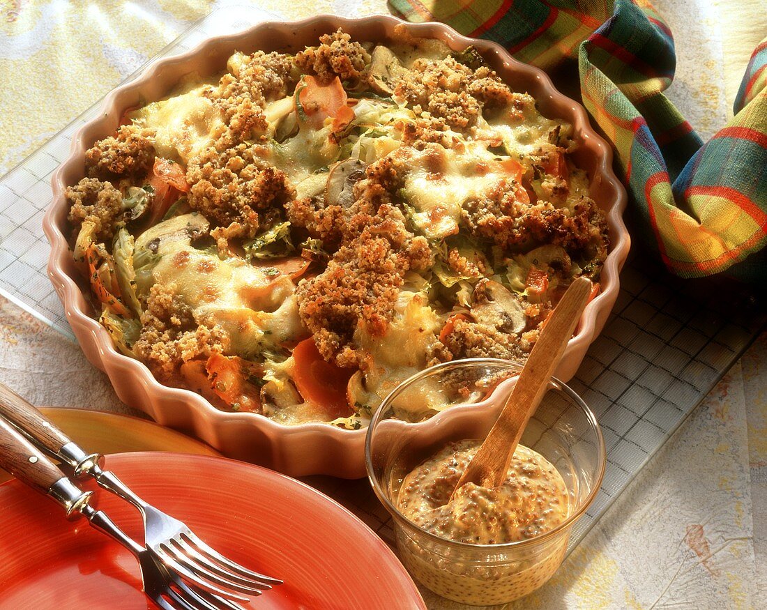 Vegetable gratin with mushrooms and mustard crust