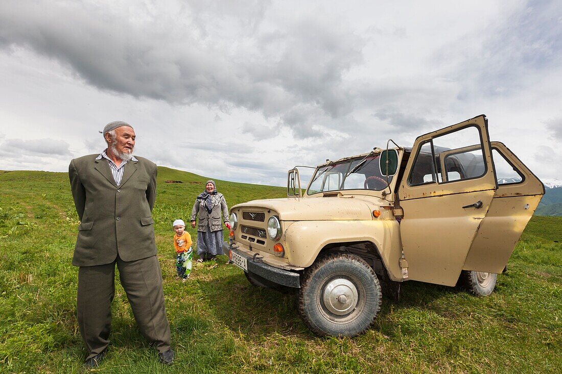 Kyrgyzstan, Naryn Province, Kyrgyz family traveling by jeep