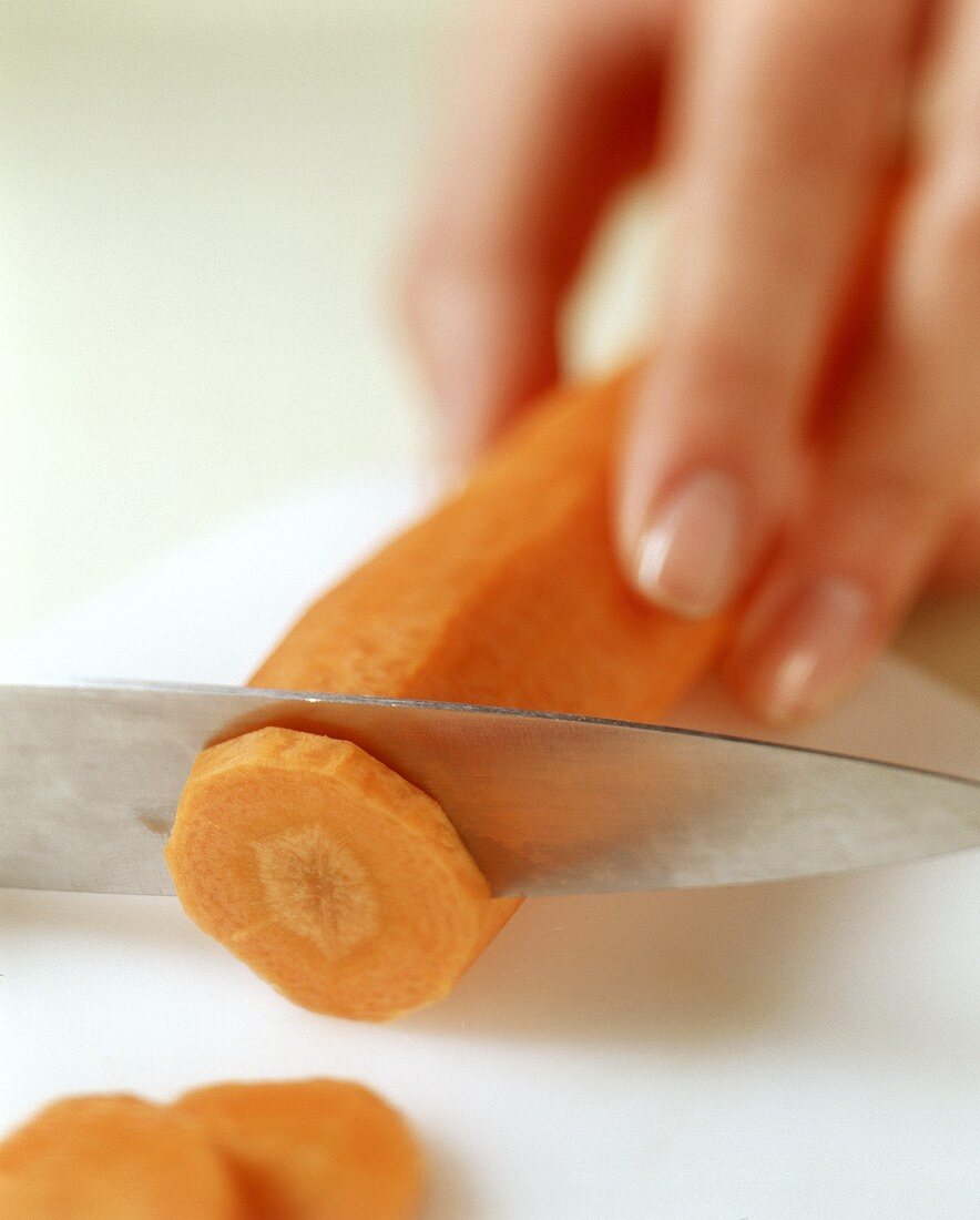 A carrot being sliced