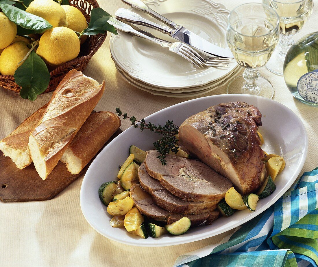 Leg of lamb with sheep's cheese and thyme stuffing & courgettes