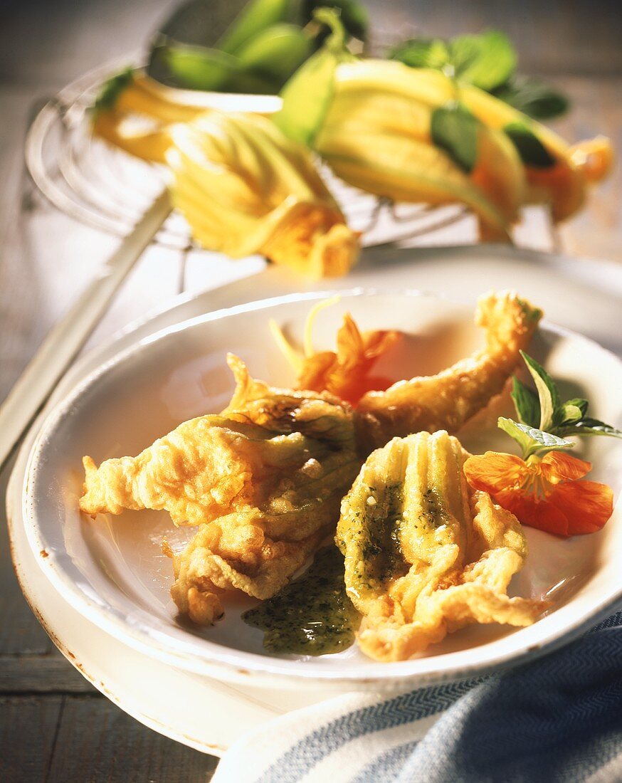Fried courgette flowers with herb sauce