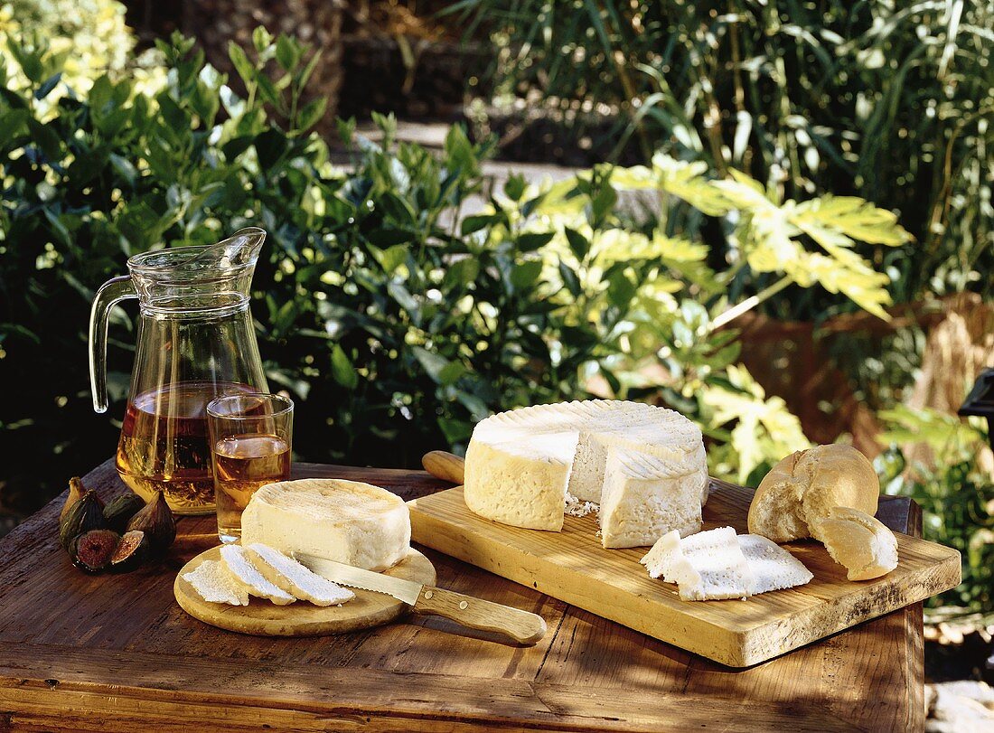 Goat's cheese from Lanzarote on wooden table (outdoors)