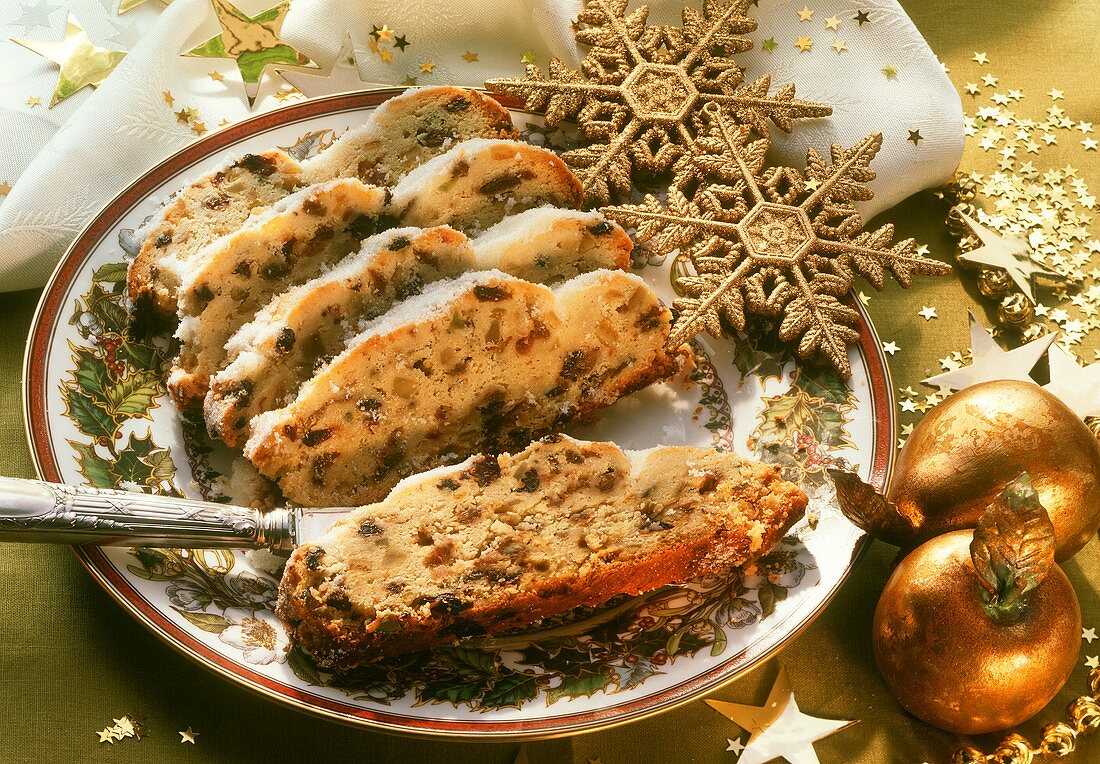 Sliced stollen on Christmas plate