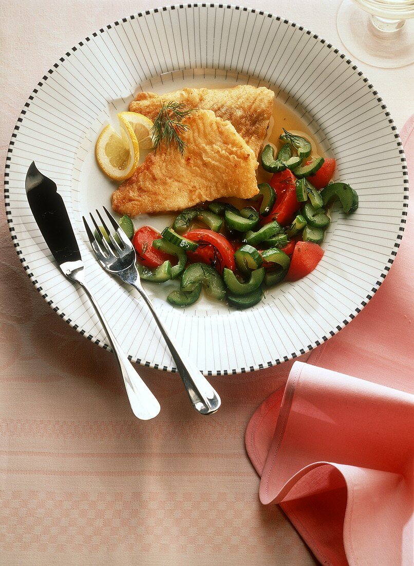 Haddock fillet with cucumber and tomatoes