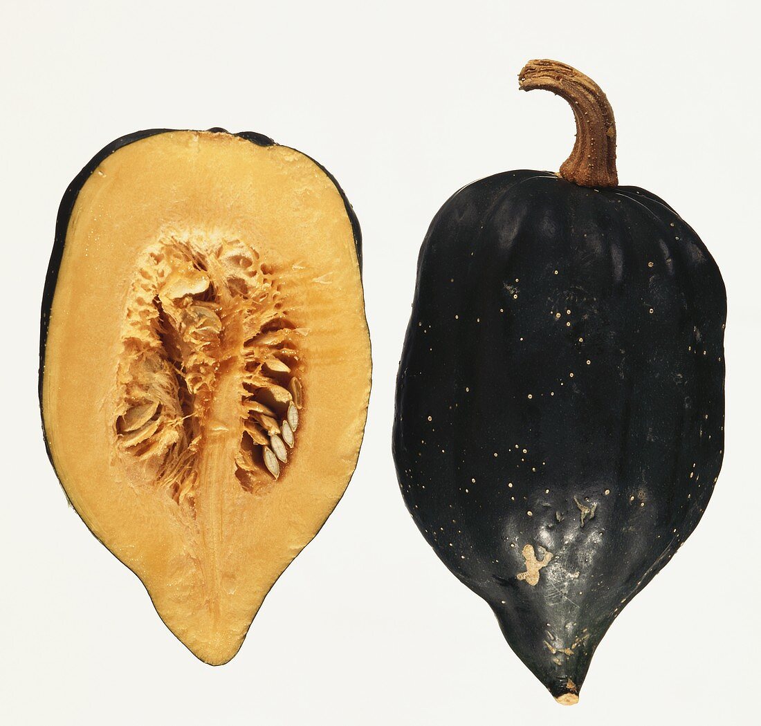 Whole and half black pumpkin