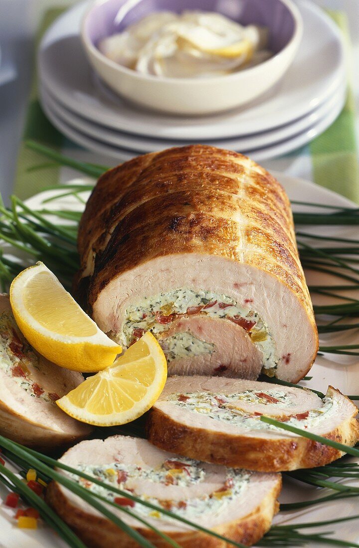 Turkey roll with pepper & cream cheese stuffing, cut into