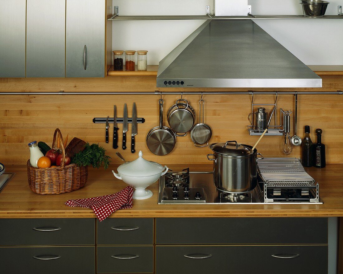 View of a kitchen with various kitchen utensils
