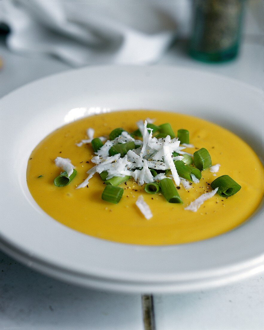 Cream of pumpkin soup with flaked coconut