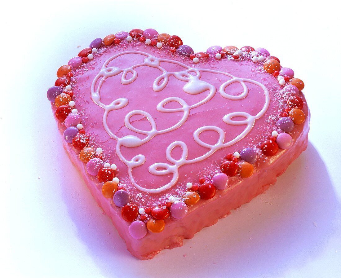 Pink love-heart with smarties and icing