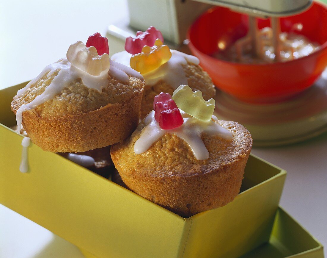 Marzipan muffins with icing and gummi bears