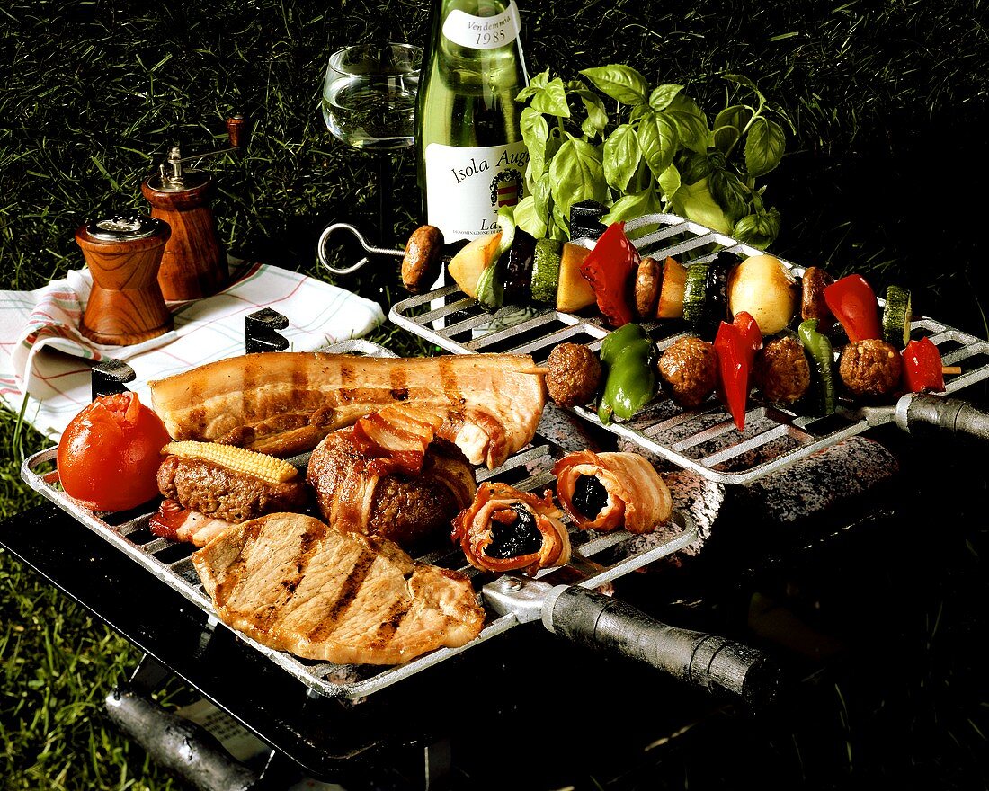 Grill with meat, skewers and vegetables