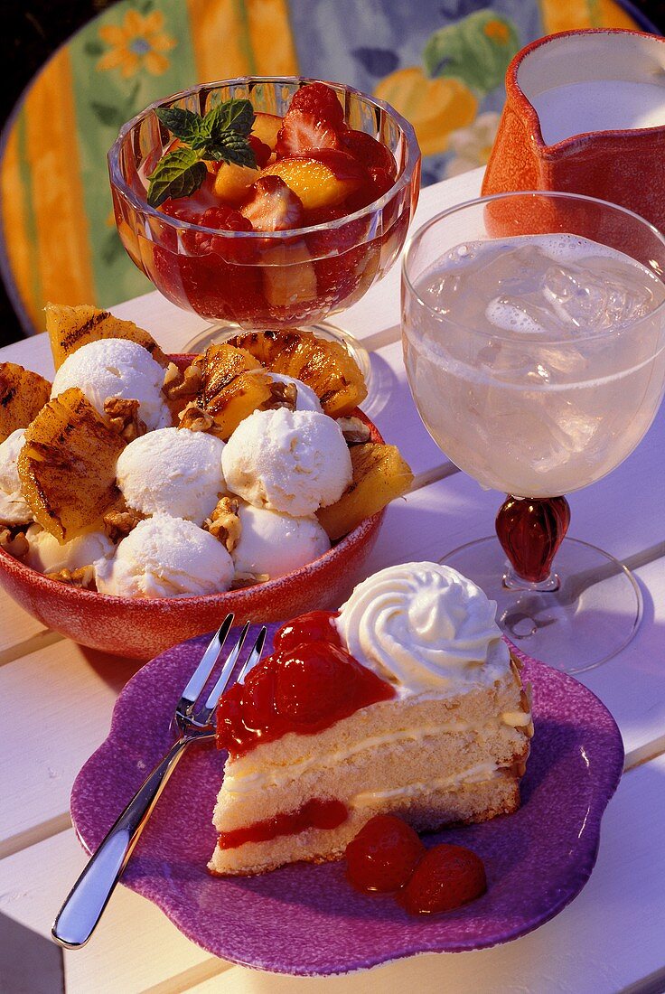 Strawberry cake, ice cream sundae, fruit salad & lemonade