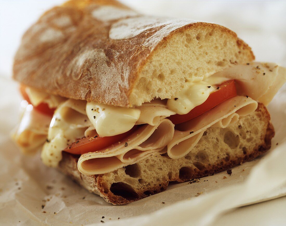 Baguette with ham, cheese and tomatoes