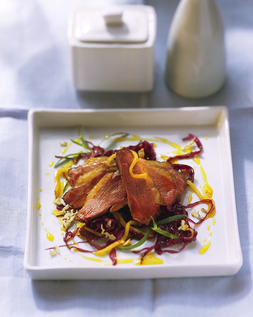 Barbery duck breast on mango and red cabbage salad