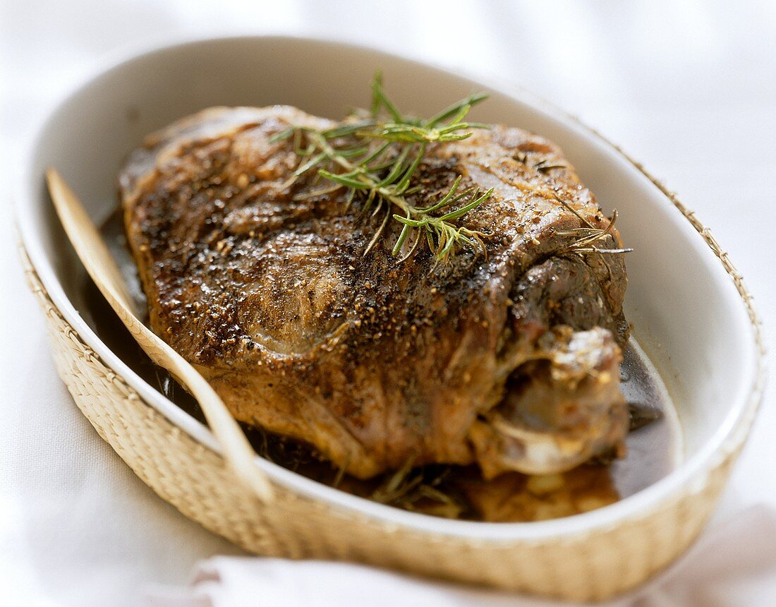 Braised leg of lamb with rosemary in a dish