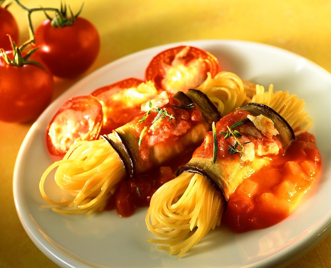 Spaghetti wrapped in aubergine on tomato sauce