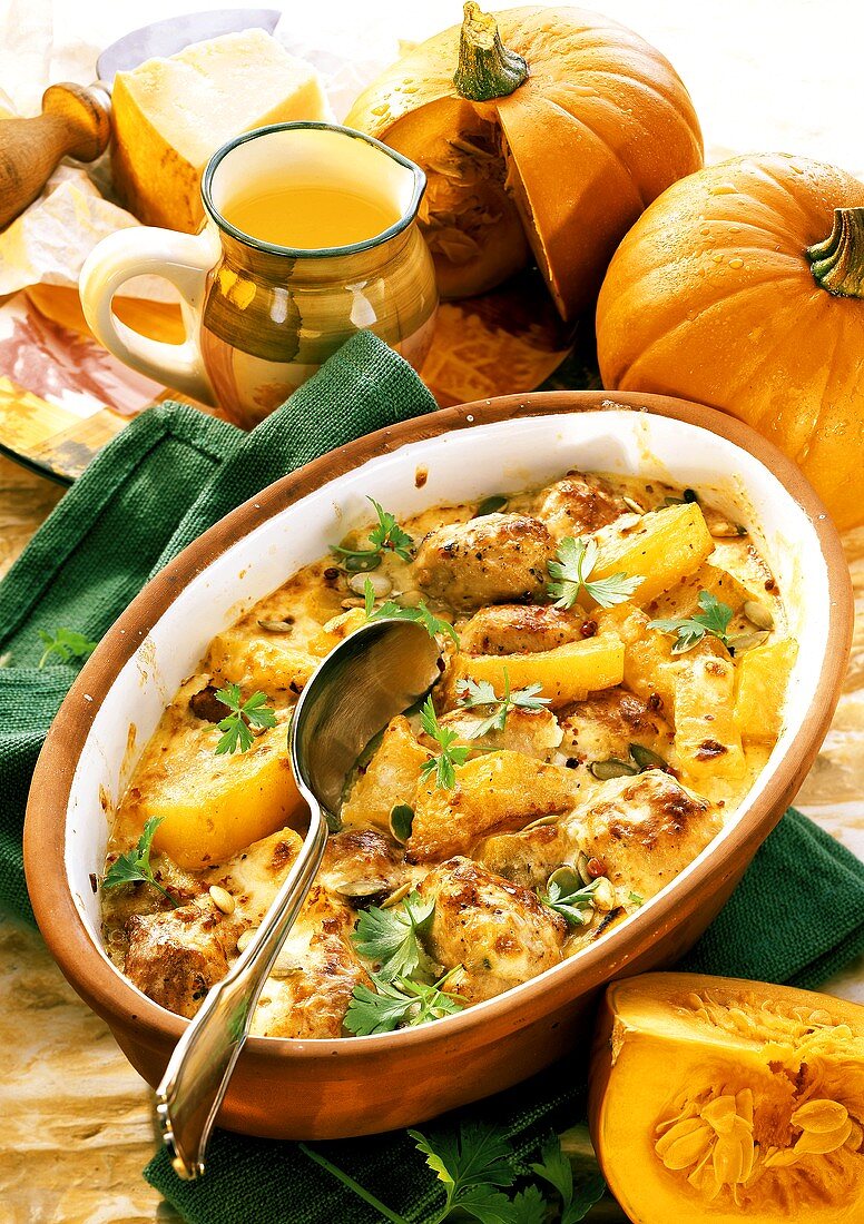 Casserole with pumpkin and sausage in casserole dish