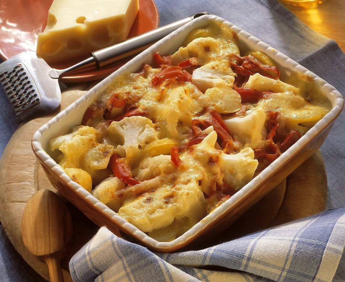 Cauliflower casserole with paprika & bacon in baking dish