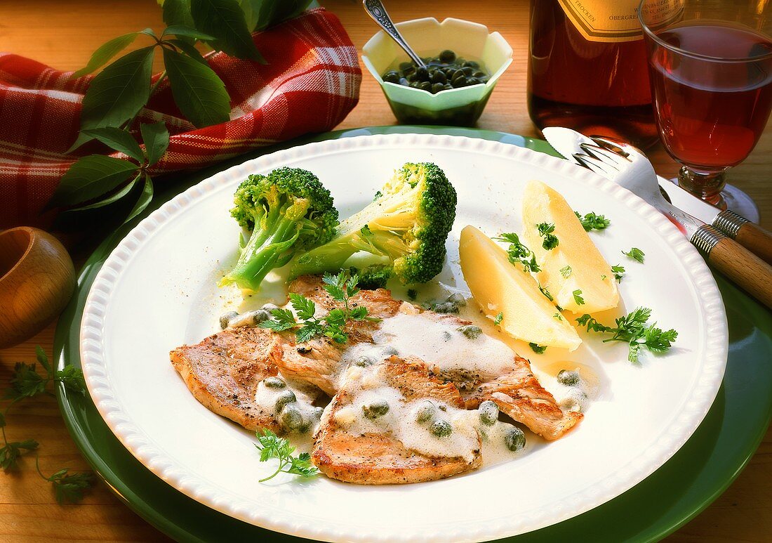 Veal escalope with caper sauce, broccoli & boiled potatoes