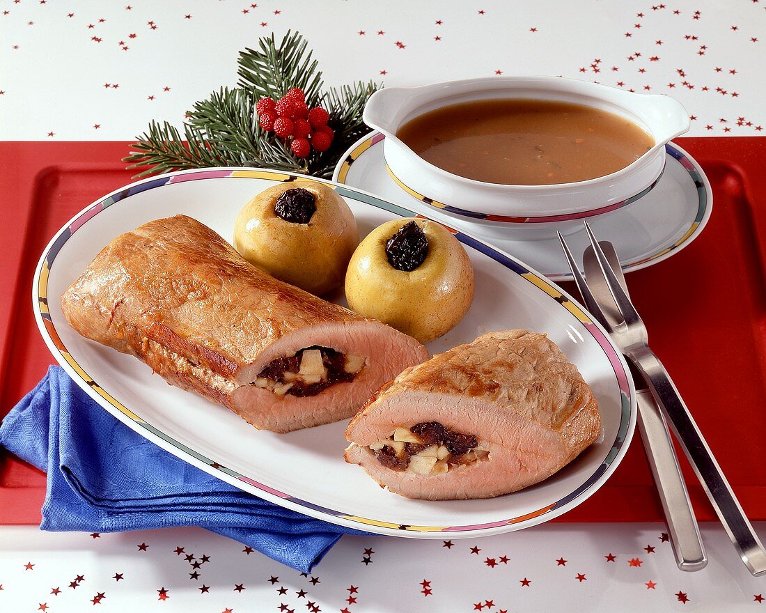 Roast pork with prune stuffing and baked apples