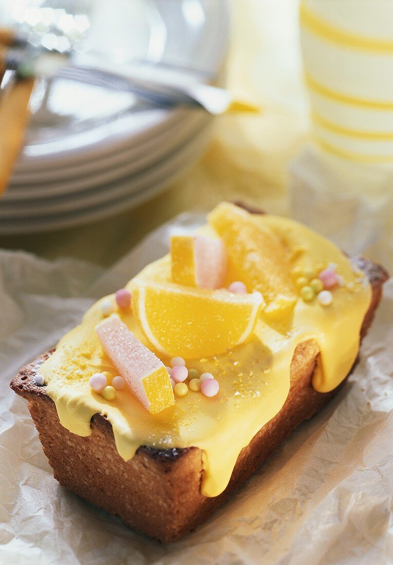 Lemon madeira cake with sweets as decoration
