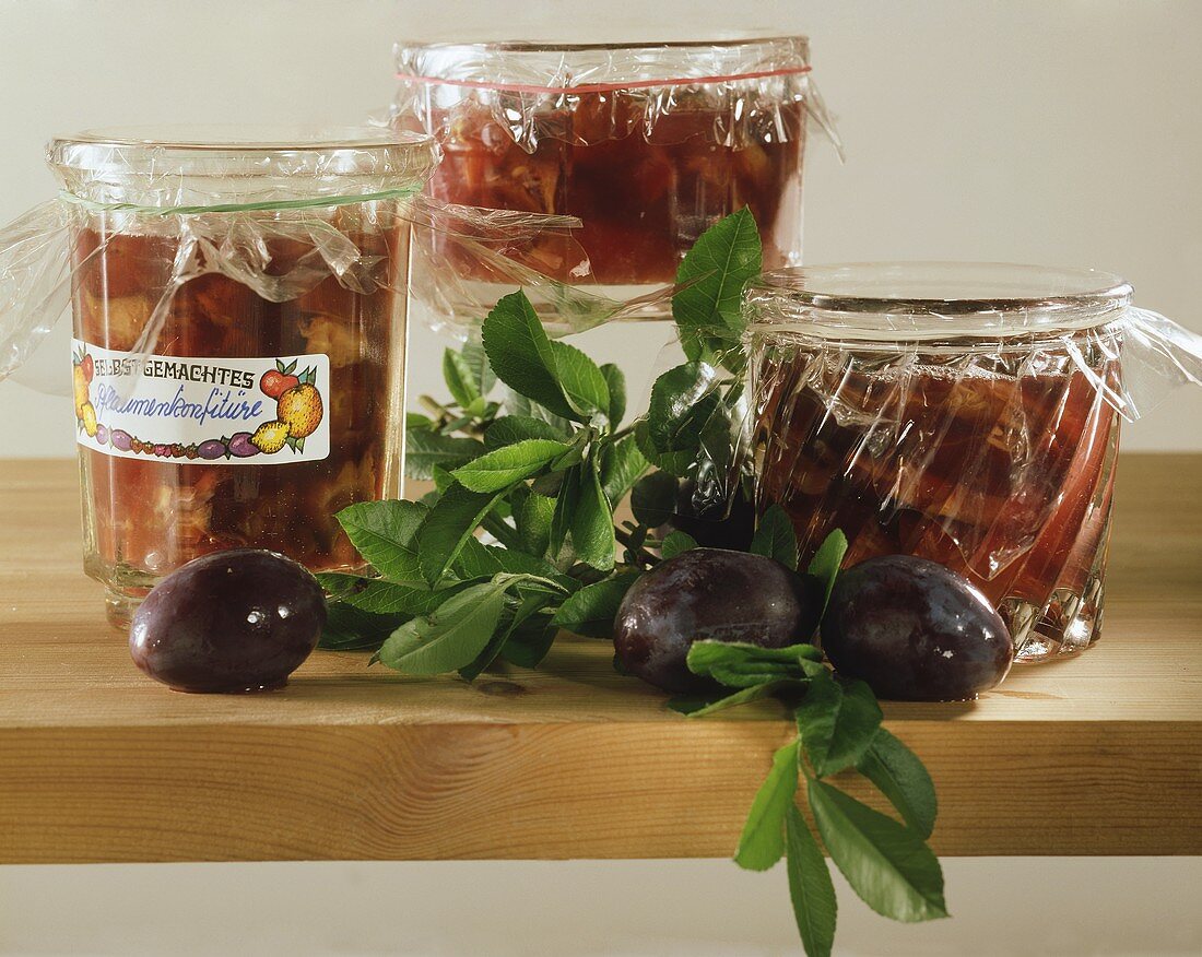Several jars of plum jam