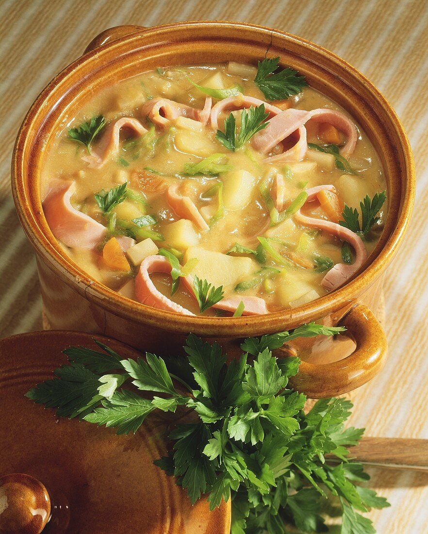 Potato stew with ham strips and parsley