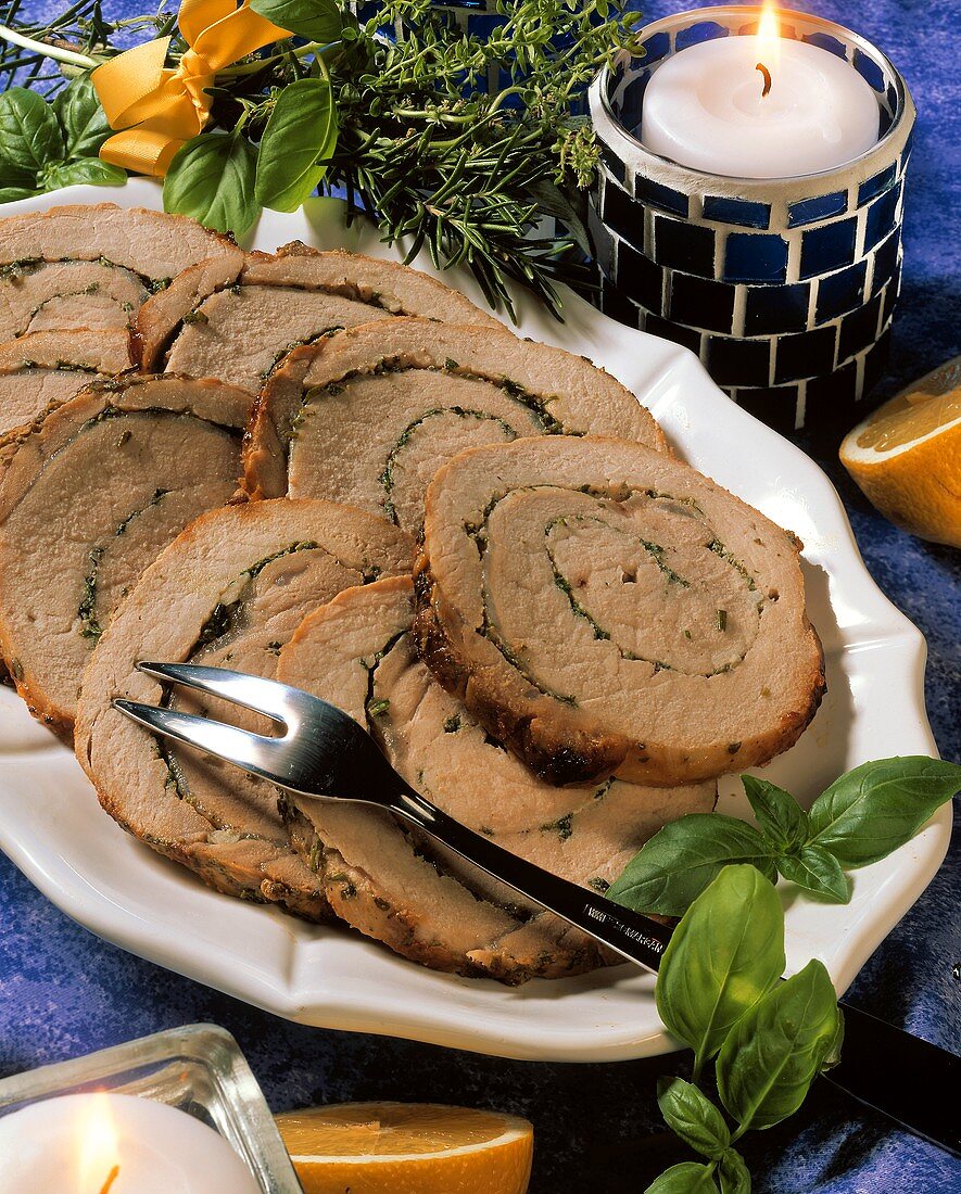 Roast pork roll with herb stuffing