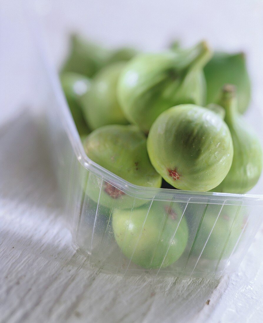 Green Figs in a Plastic Container