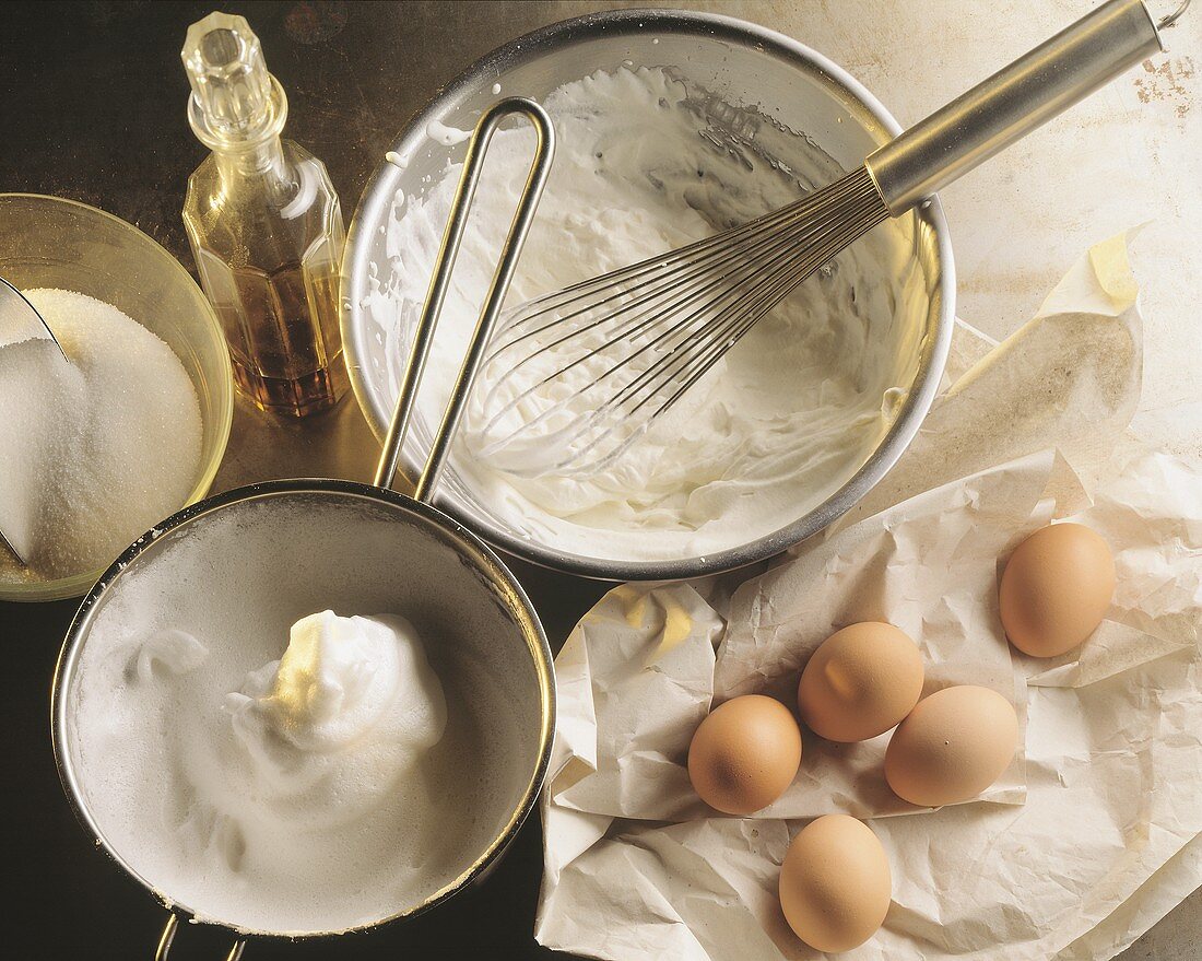 Ingredients still life: eggs, sugar, egg white, alcohol & cream