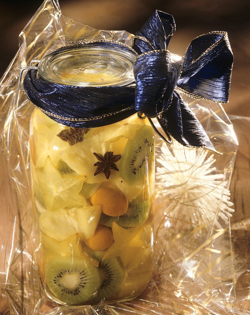 Exotic rumtopf with kumquats, pineapple, kiwis & carambolas