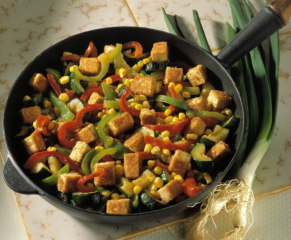Mixed vegetables with fried tofu in the pan