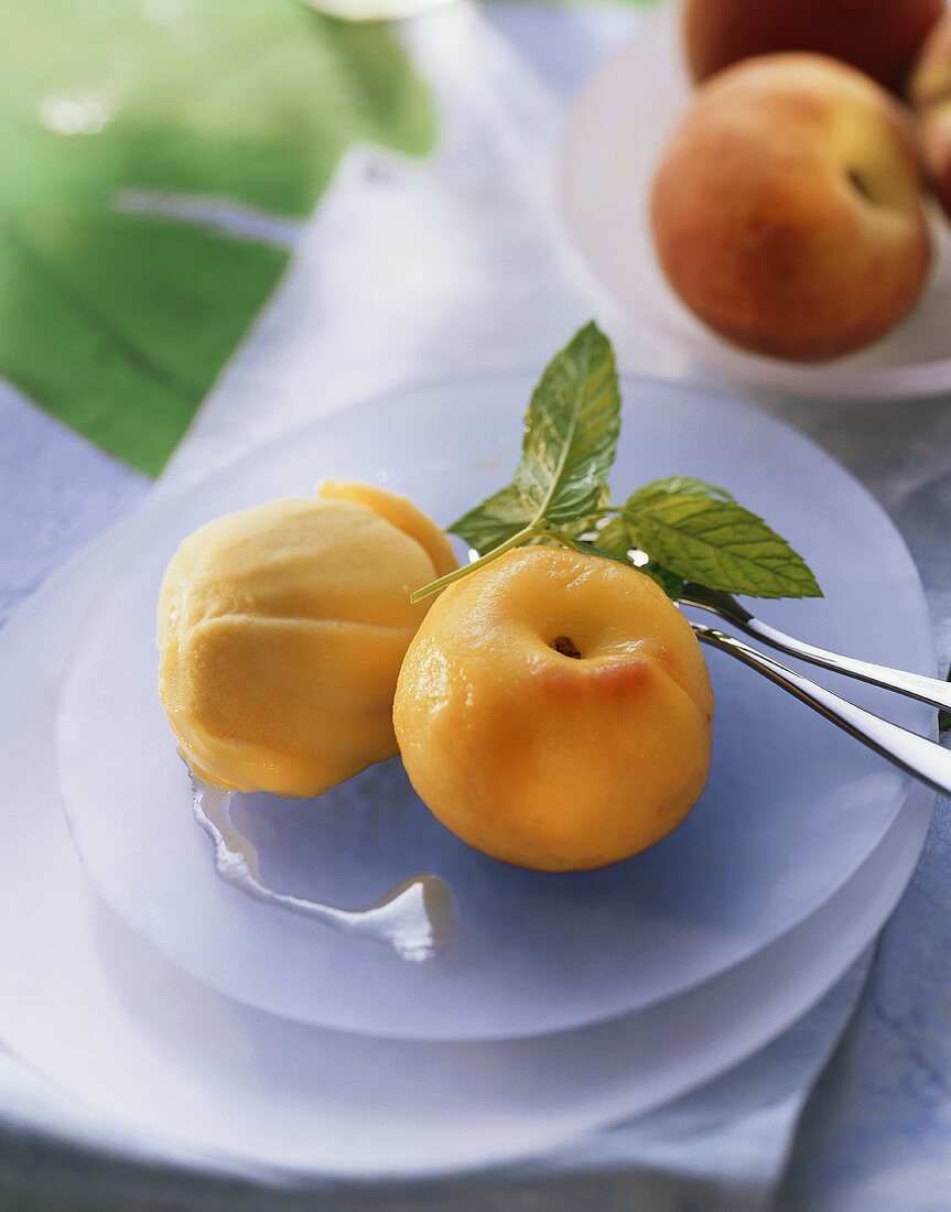 Peach in white wine with mango sorbet