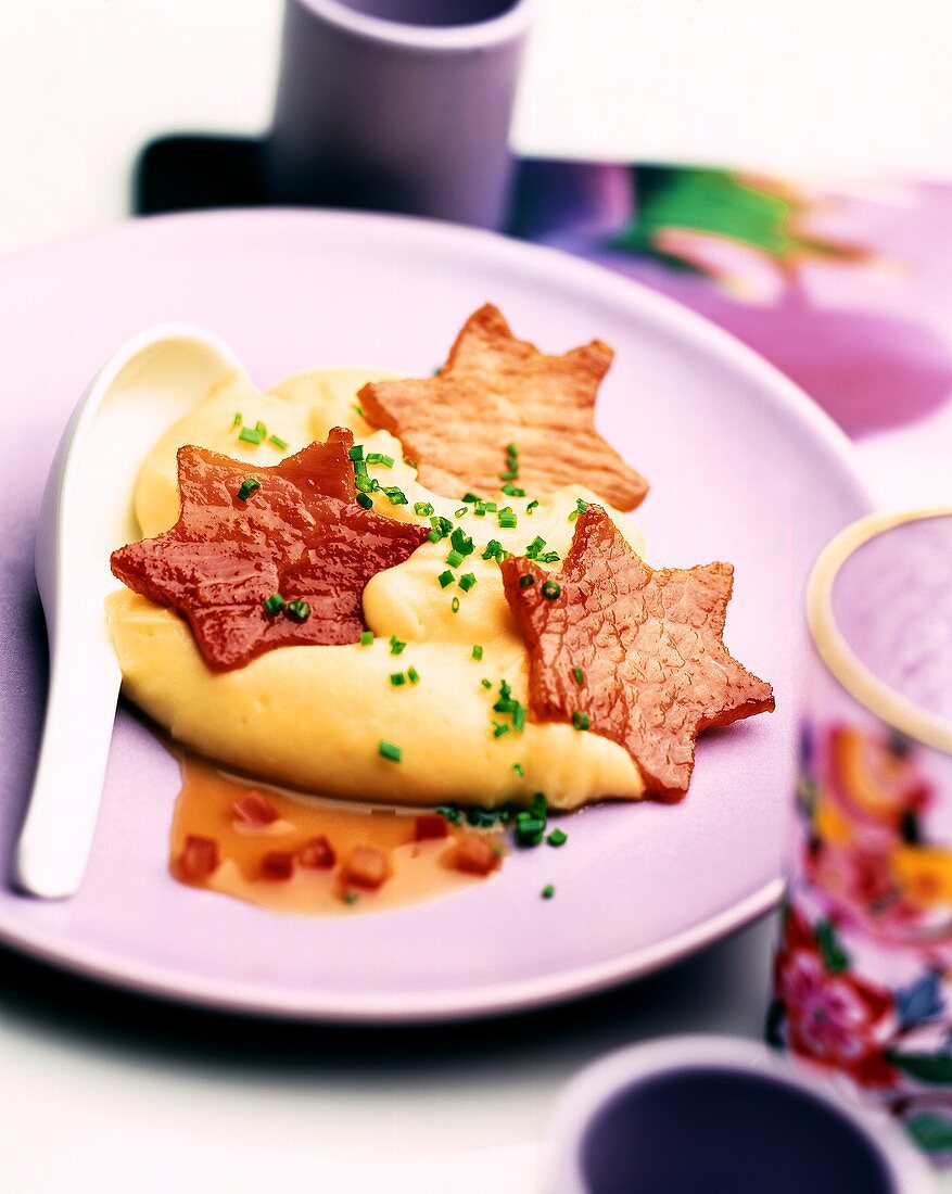 Fried ham stars on mashed potato