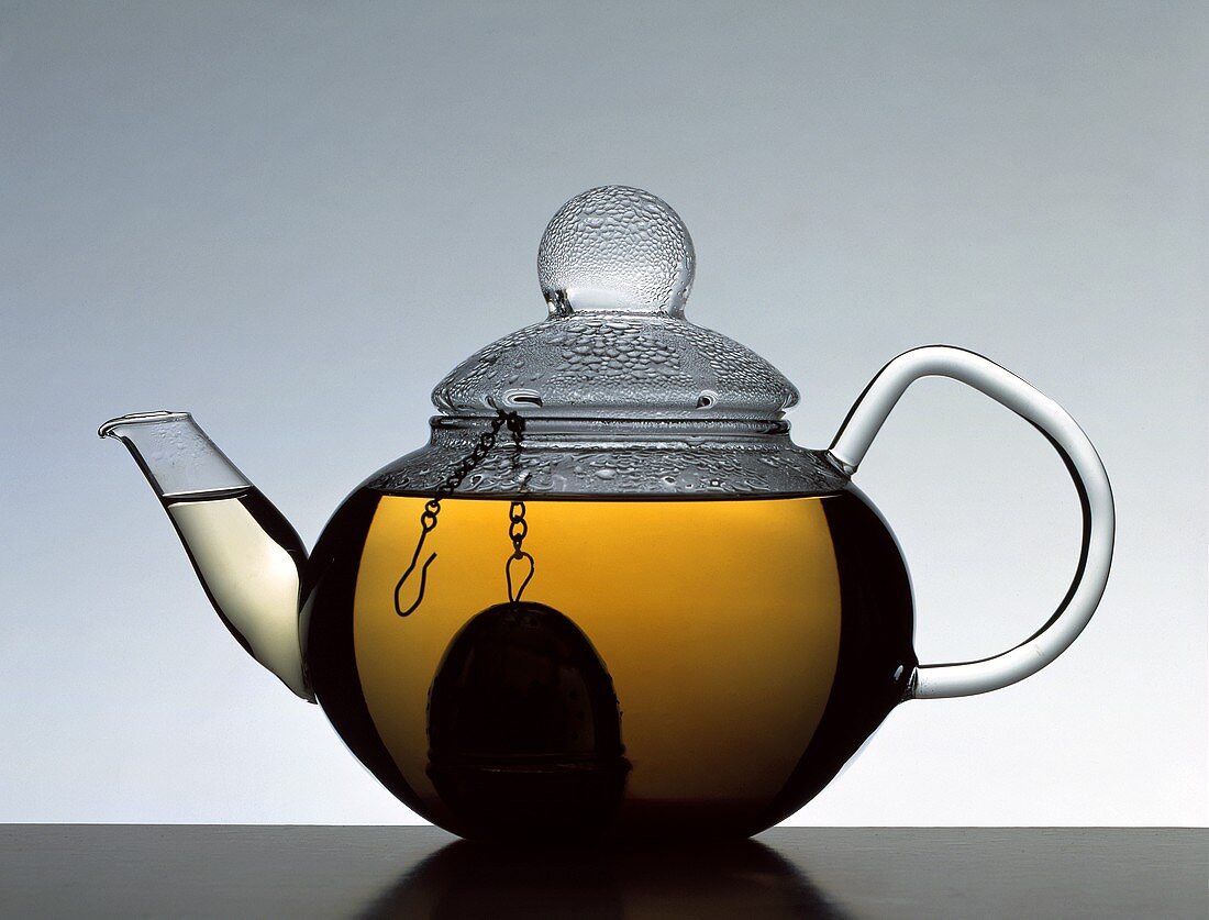 A pot of tea with tea infuser