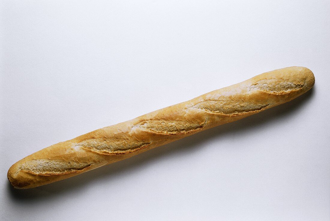A baguette stick against white background
