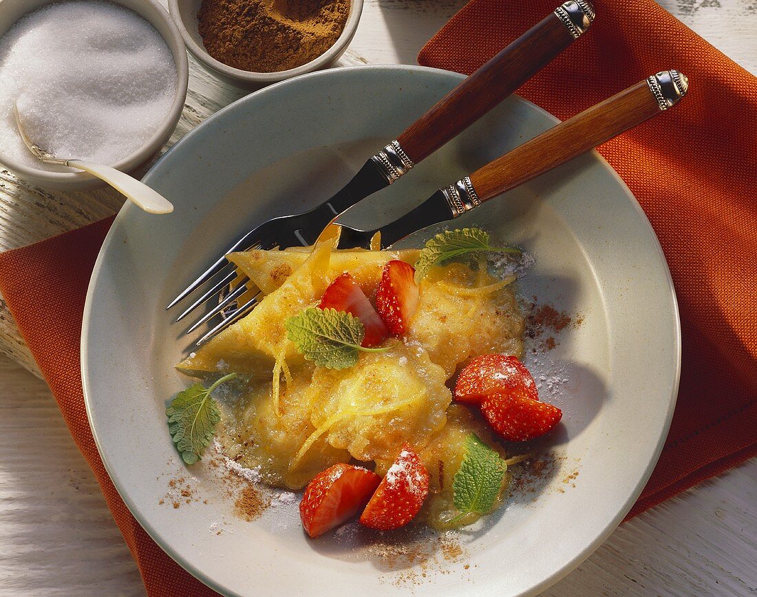 Sweet ravioli in lemon butter with fresh strawberries