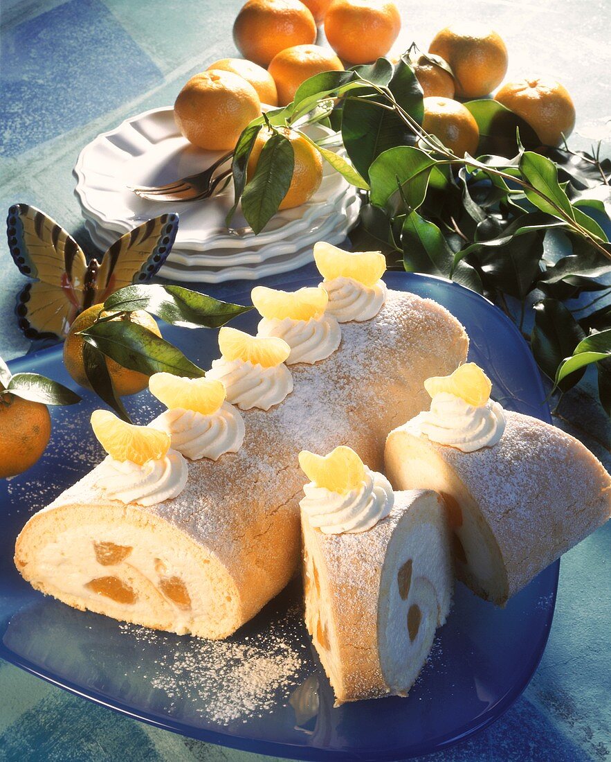 Sponge roll with mandarin cream, decoration: mandarins