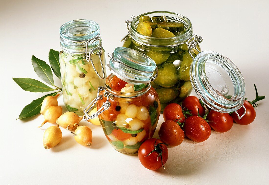 Three preserving jars with pickled vegetables