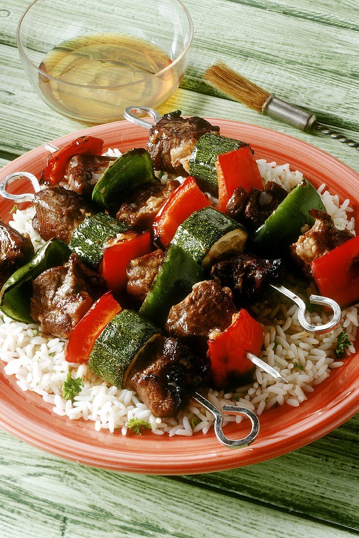 Lamb and vegetable kebabs on a bed of rice