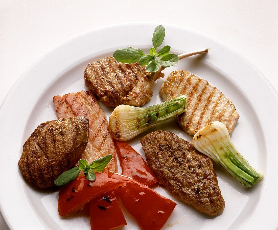 Plate of various grilled meats and vegetables