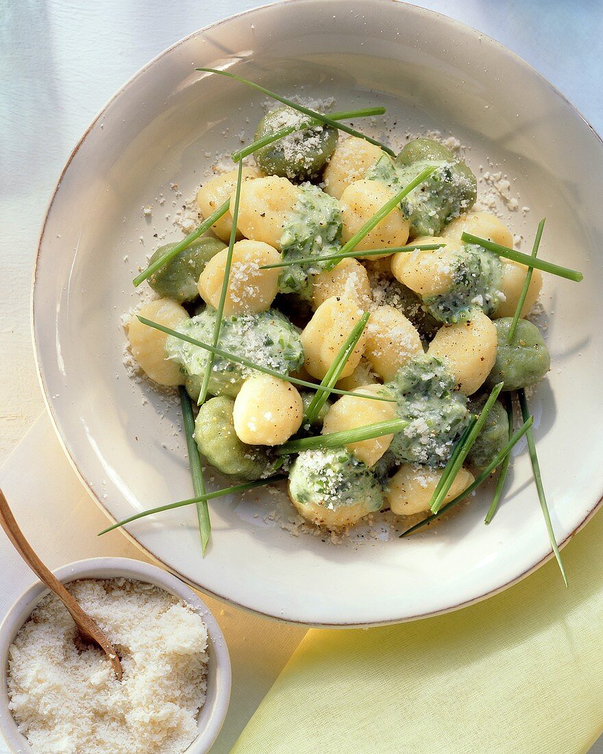 Gnocchi with herb sauce on plate