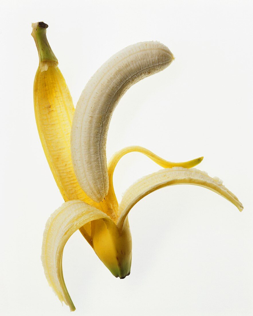 Peeled banana and banana skin