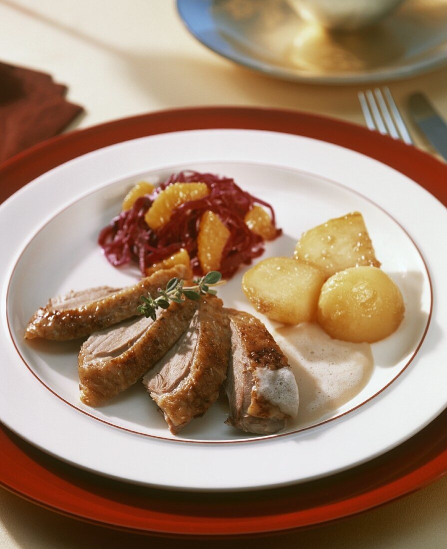 Duck, red cabbage with oranges & caramelised potatoes