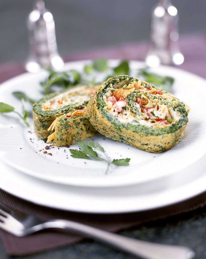 Herb omelette roulade with salmon and vegetable filling